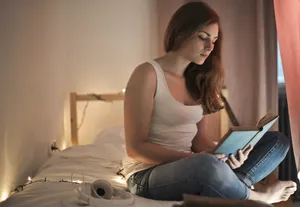 Attractive woman working on laptop in home office