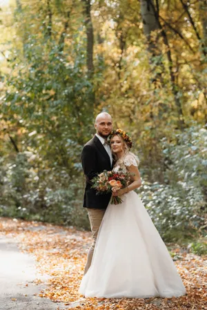 Happy married couple outdoors in wedding attire