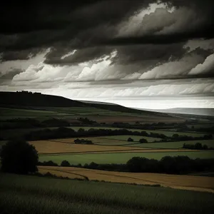 Vibrant countryside sunset over rolling hills.