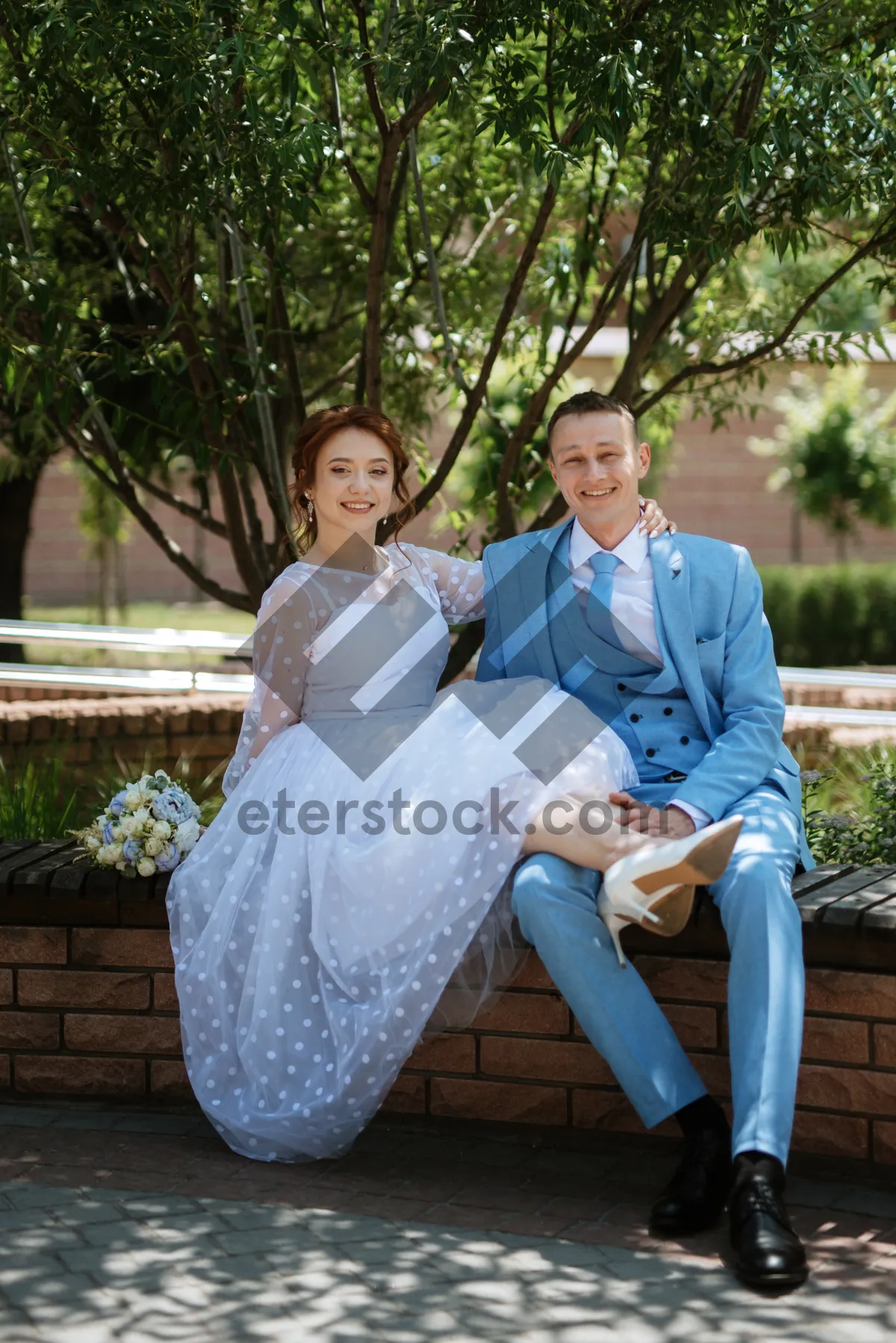 Picture of Happy couple in park on wedding day celebrate love.