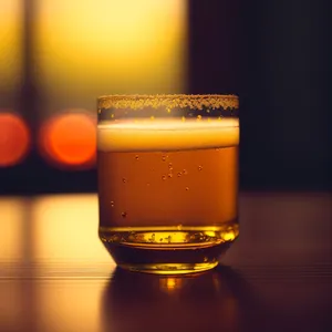 Cold Frothy Beer in Glass Mug.