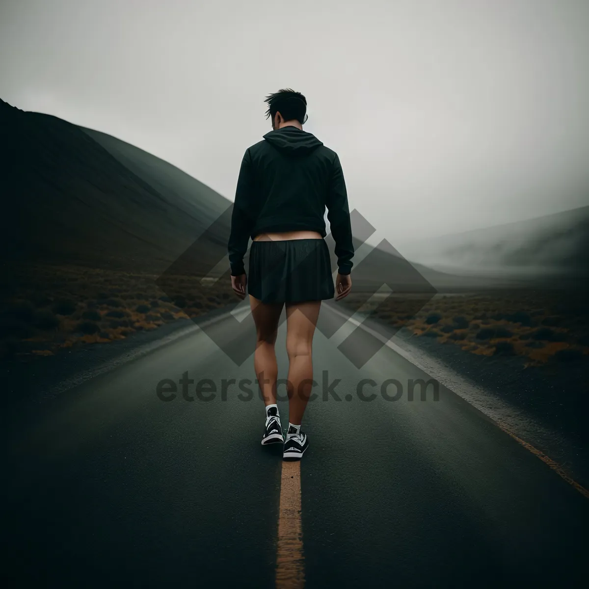 Picture of Majestic Mountain Sunset Hike: Adventurous Man Embracing Nature