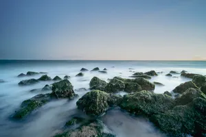 Tropical Cape Sunset Beach With Waves