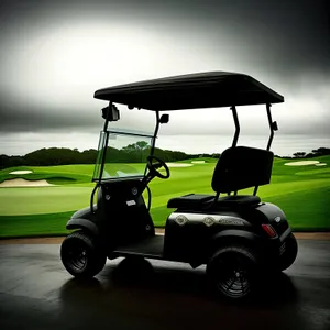 Golfer driving golf cart through lush green course