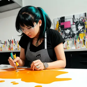 Smiling Businesswoman Working on Laptop at Office Desk