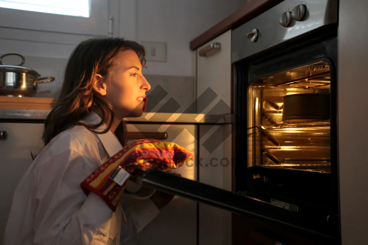 Picture of Happy people cooking in a cozy kitchen.