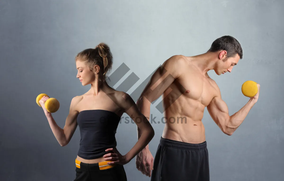 Picture of Muscular male model posing shirtless in jeans fashion shoot.