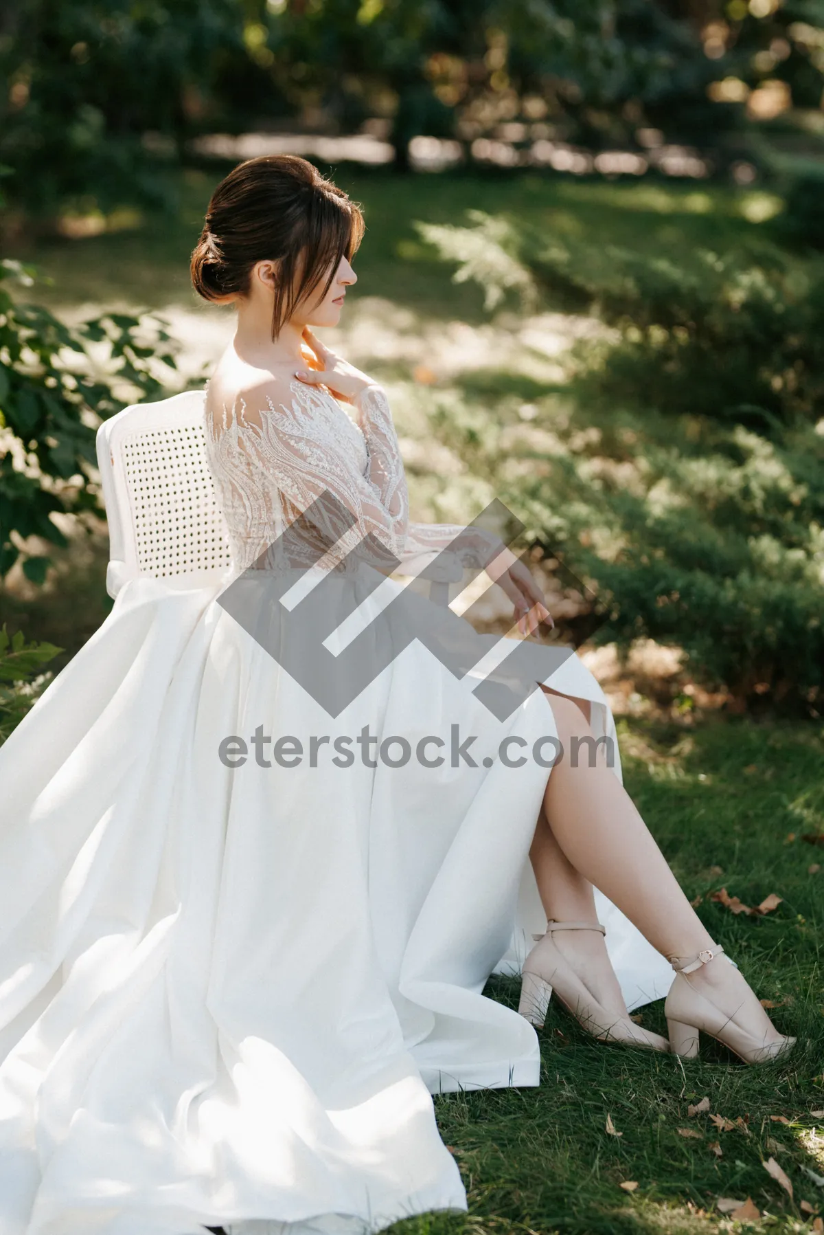 Picture of Fashionable Bride Smiling Happily with Bouquet