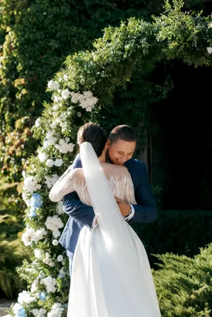 Happy bride and groom celebrating their wedding day outdoors.