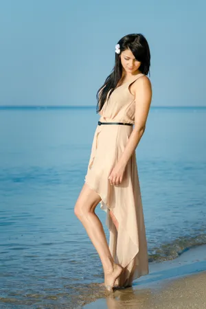 Attractive woman in fashion swimsuit enjoying beach vacation.