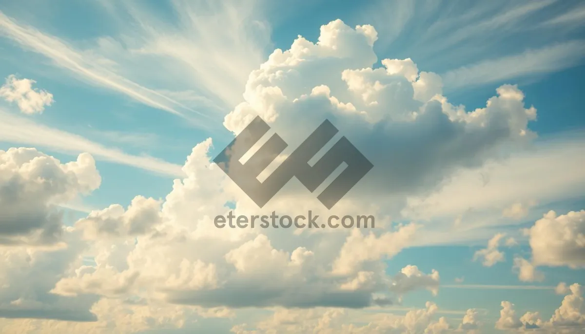 Picture of Clear Summer Sky with Fluffy Clouds and Bright Sun