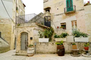 Historic stone church with ancient balcony and door.