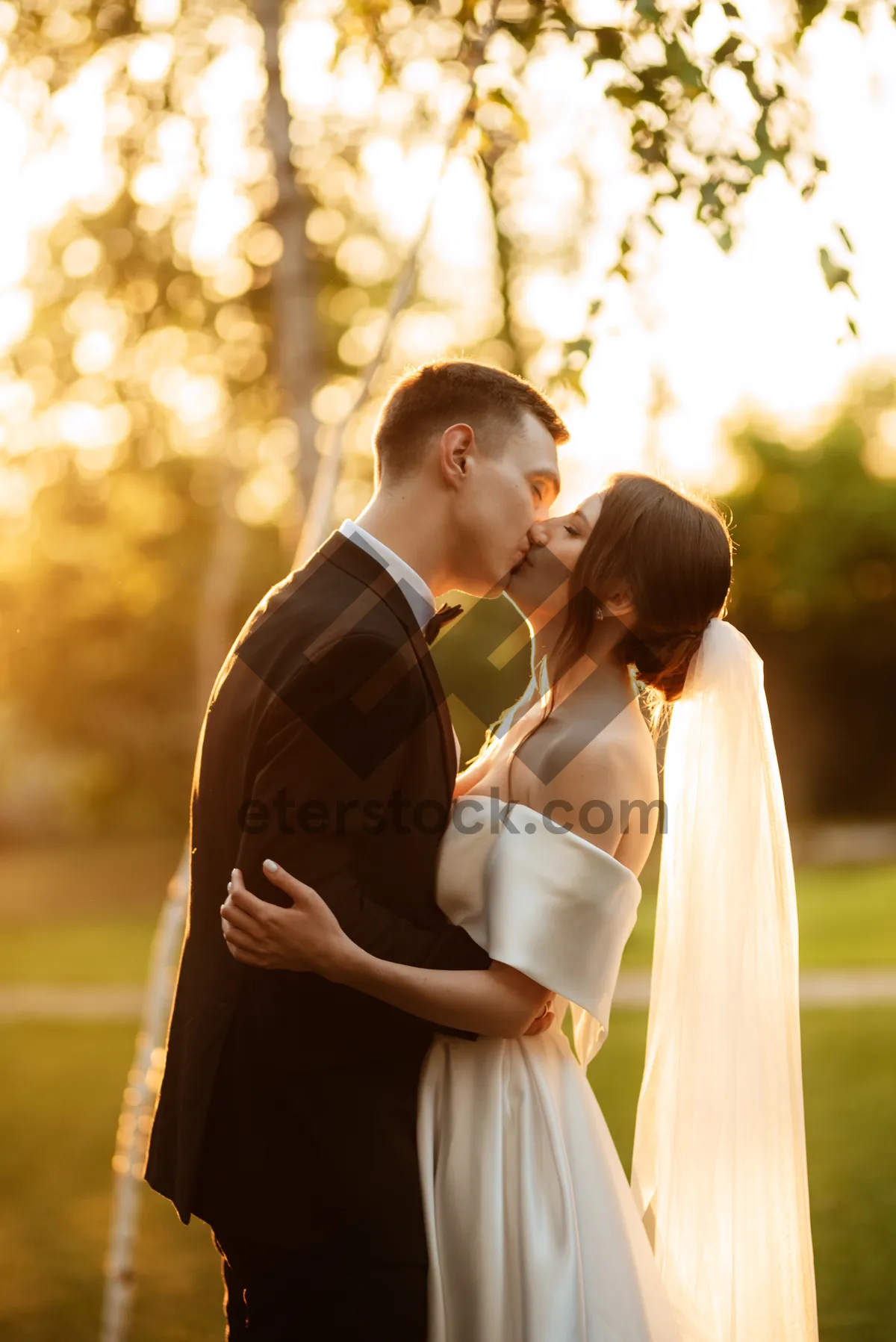 Picture of Happy newlywed couple at outdoor park wedding portrait.