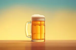 Yellow frothy beer in glass mug on bar counter.