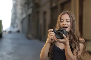 Portrait of young brunette woman smiling in studio.