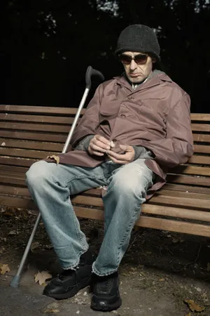 Man sitting on park bench outdoors