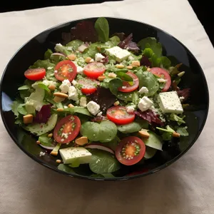 Gourmet vegetable salad with grilled meat and cheese
