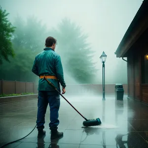 Golfer using a cleaning swab on course