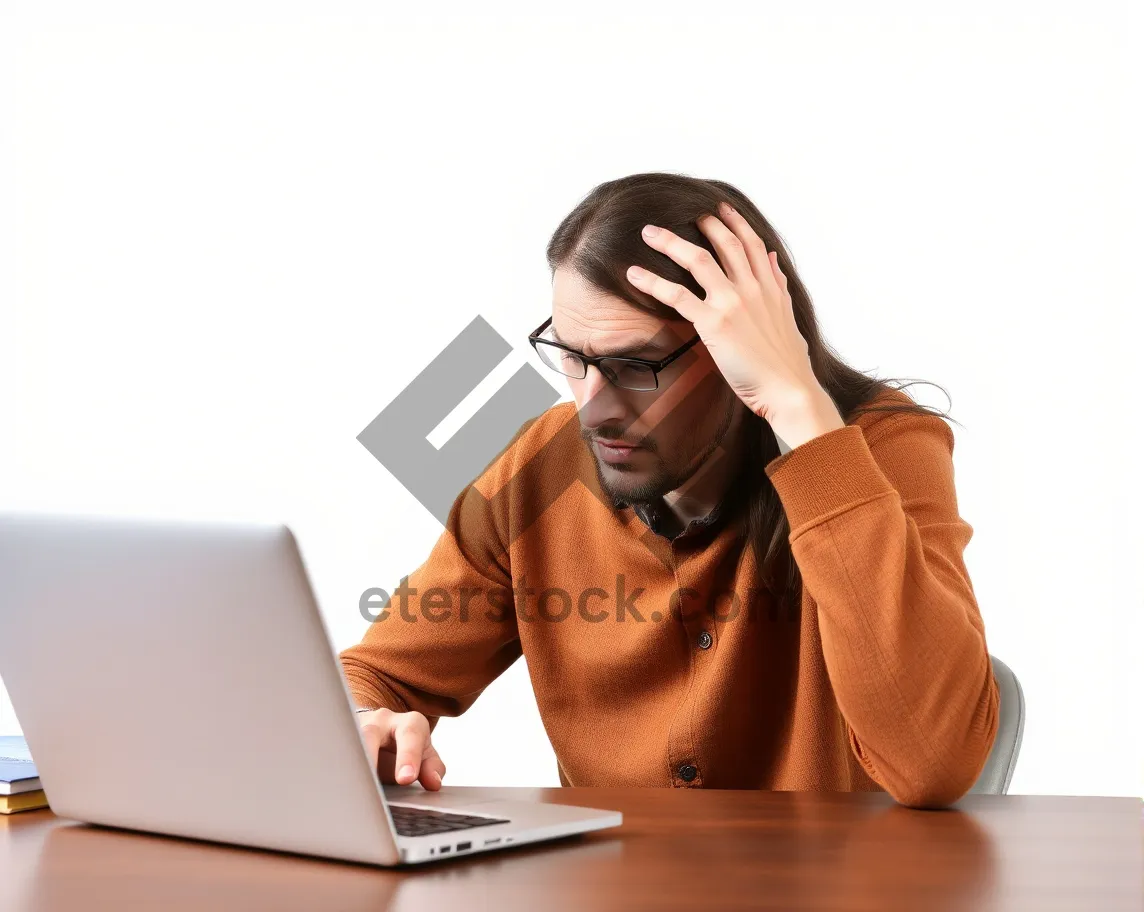 Picture of Confident businesswoman working on laptop in office.