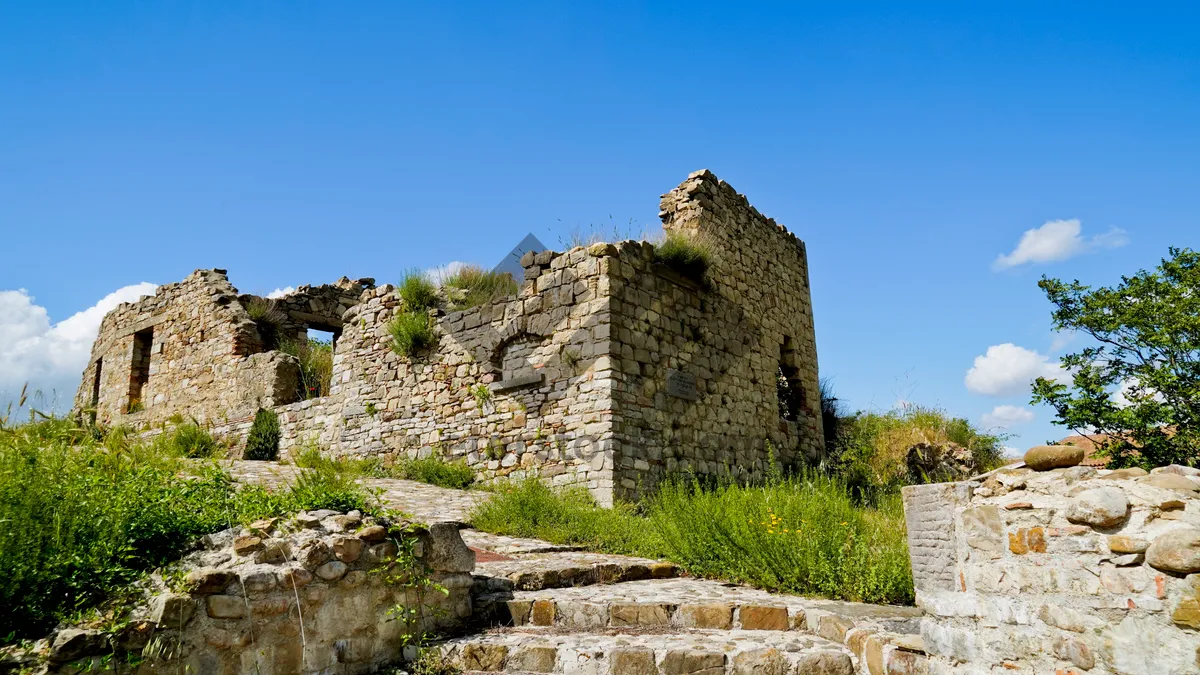 Picture of Medieval castle fortress overlooking ancient ruins and fortification.