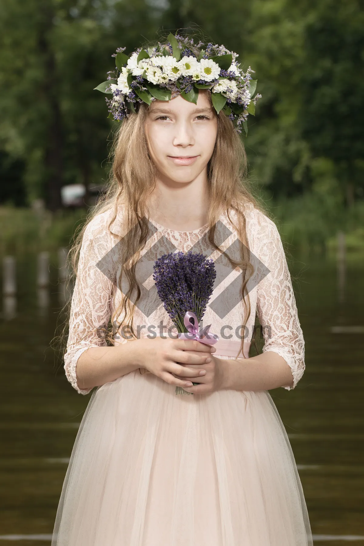 Picture of Smiling lady model in embroidered dress at the park