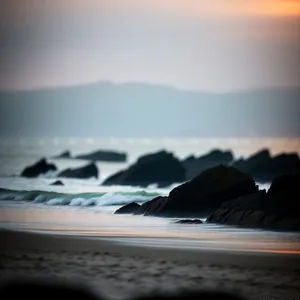 Serenity at Sunset: Coastal Waves Embracing Nature's Canvas