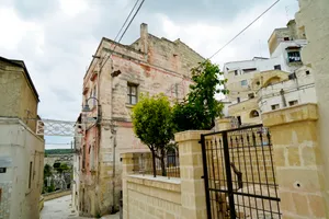 Ancient palace with stone walls and sky backdrop.