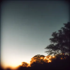 Radiant Sunset Sky with Glowing Rays