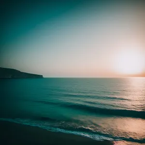 Turquoise Seascape: Tranquil Waves on a Sunny Beach