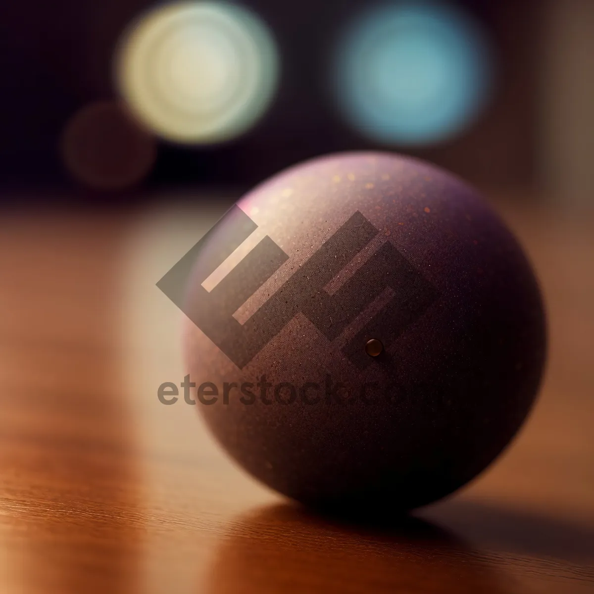 Picture of Round Egg-shaped Bowling Ball on Black Table