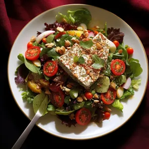 Healthy vegetable salad with grilled meat and tangy sauce.