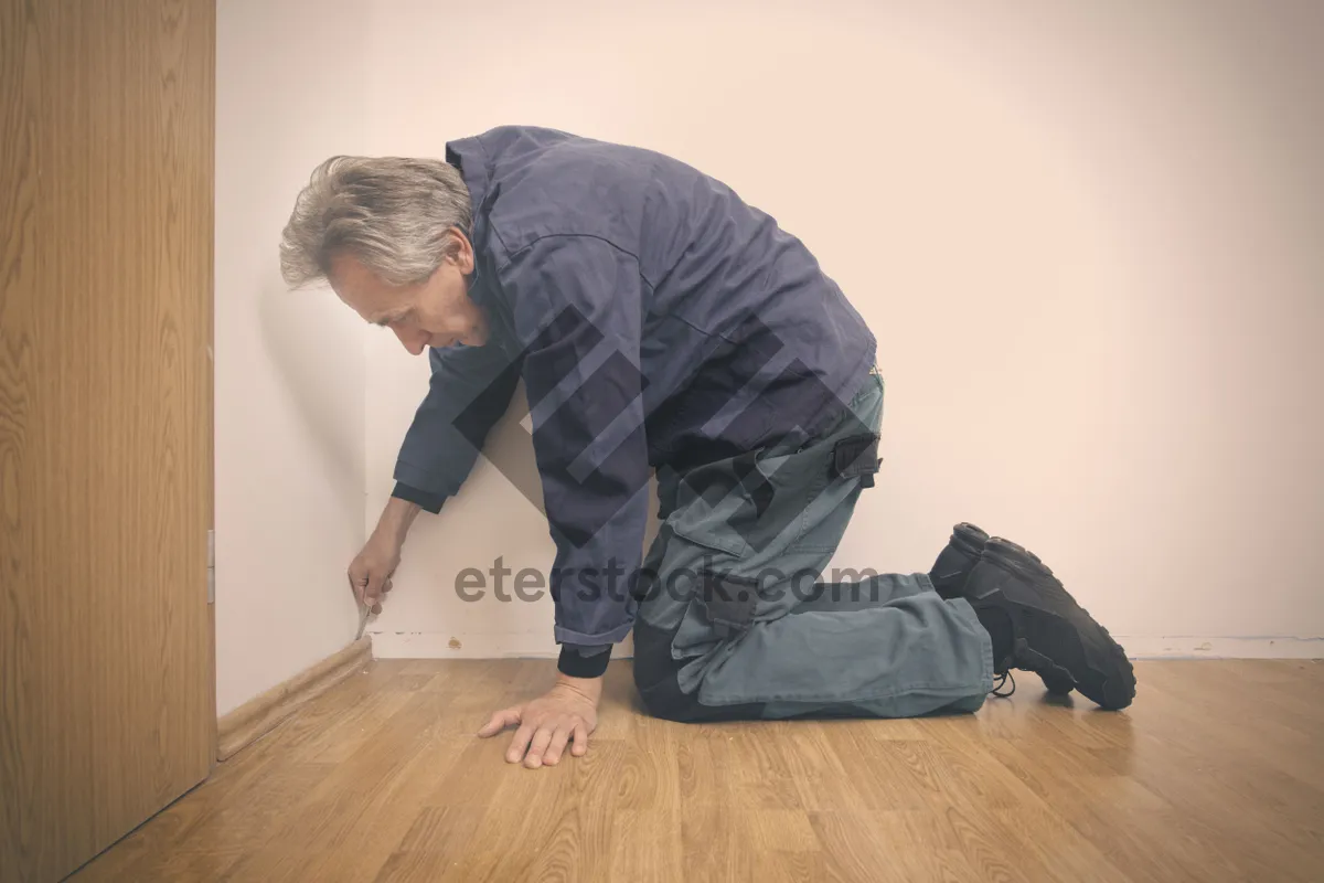 Picture of Man sleeping on couch with sleeping bag and backpack