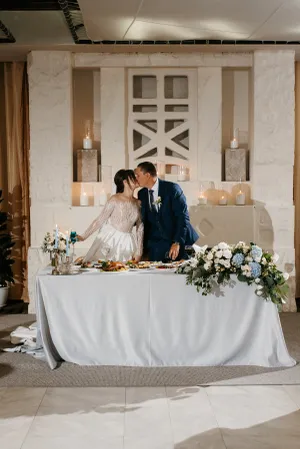 Happy married couple celebrating their wedding day with flowers