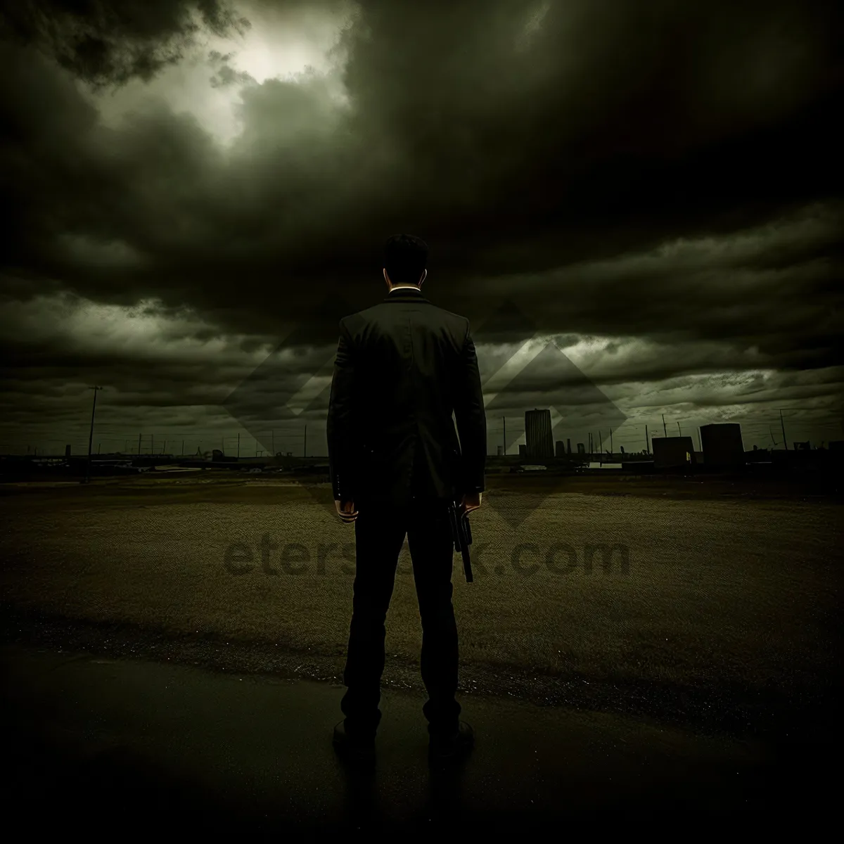 Picture of Silhouette of a Man Watching Sunset by the Beach