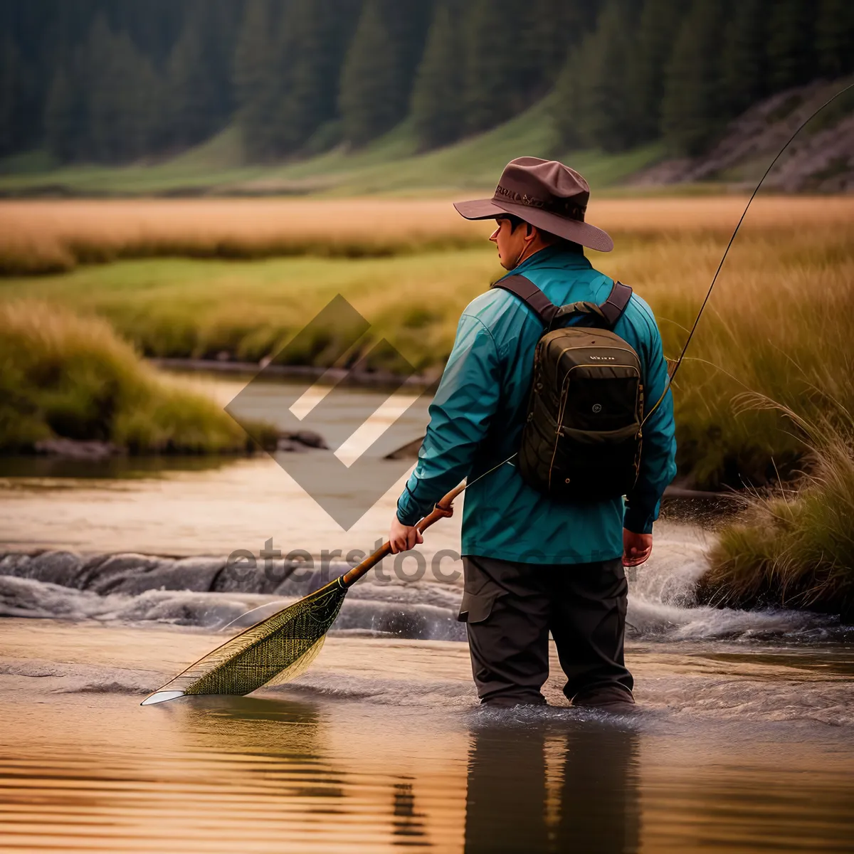 Picture of Active Fisherman on the River with Paddle and Fishing Rod