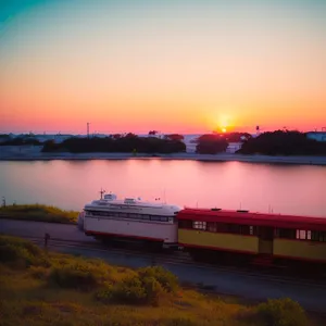 Container ship sailing through picturesque harbor