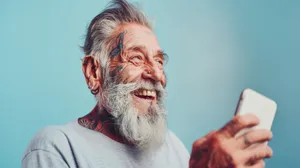 Elderly Couple Smiling Together at Retirement Party