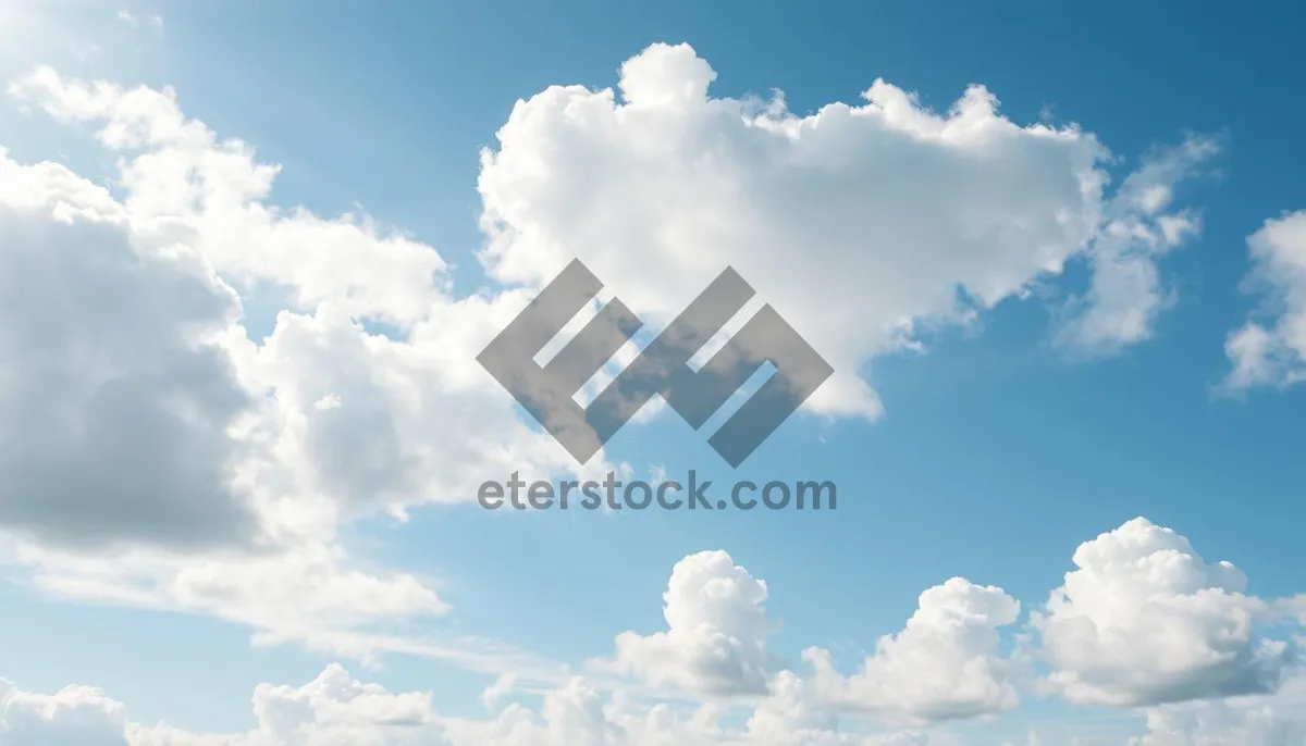 Picture of Bright Summer Sky Landscape with Fluffy Clouds.