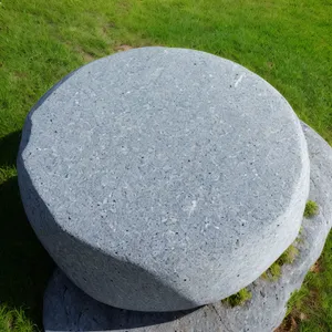 Golf Ball on Grass with Stone Memorial