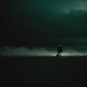 Serenity by the Sea: Sunset Silhouette of Fisherman on the Horizon