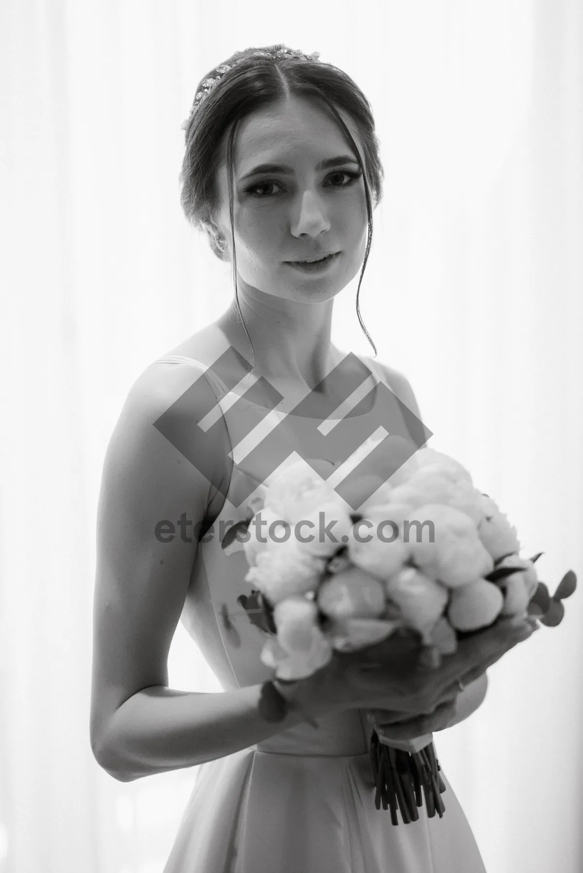 Picture of Attractive bride holding bouquet of blackberries and flowers