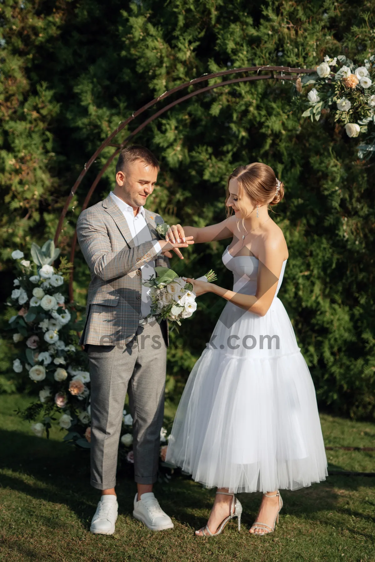 Picture of Happy couple celebrating outdoors on their wedding day