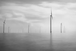 Wind Turbine Generating Power at Sunset in Marina