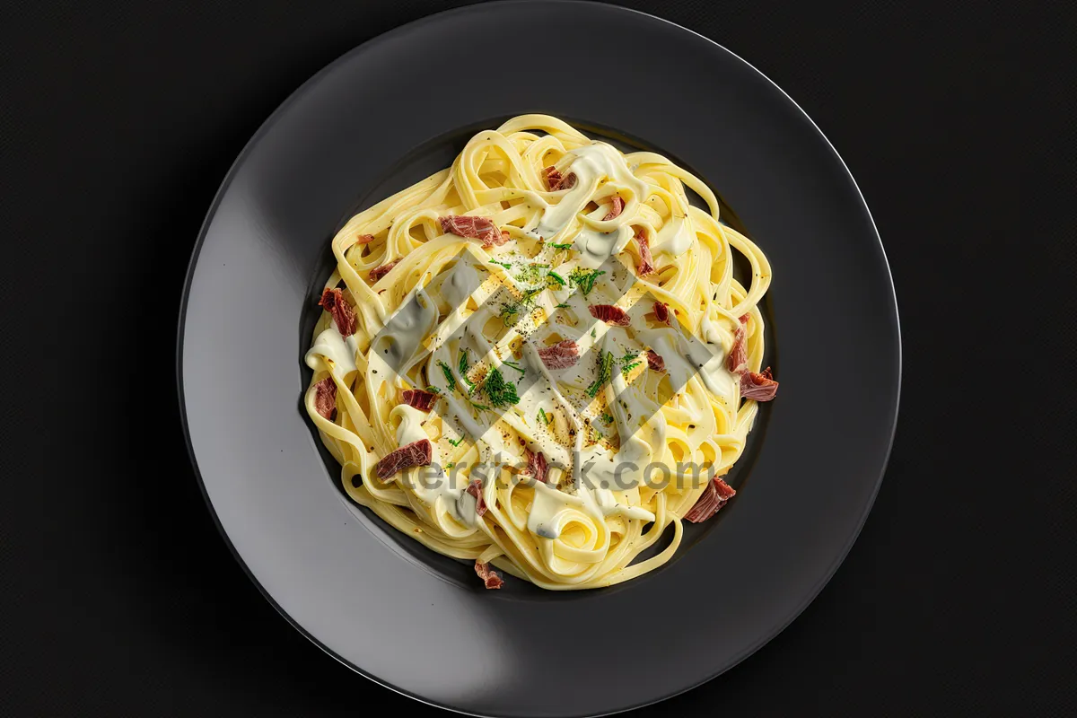 Picture of Savory Plate of Gourmet Pasta with Cheese and Tomatoes