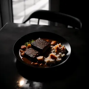 Delicious gourmet lunch plate with cooked meat and pepper
