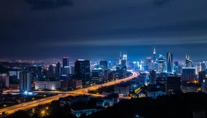 Modern city skyline reflecting in river at dusk