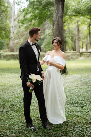 Happy couple celebrating wedding outdoors in the day