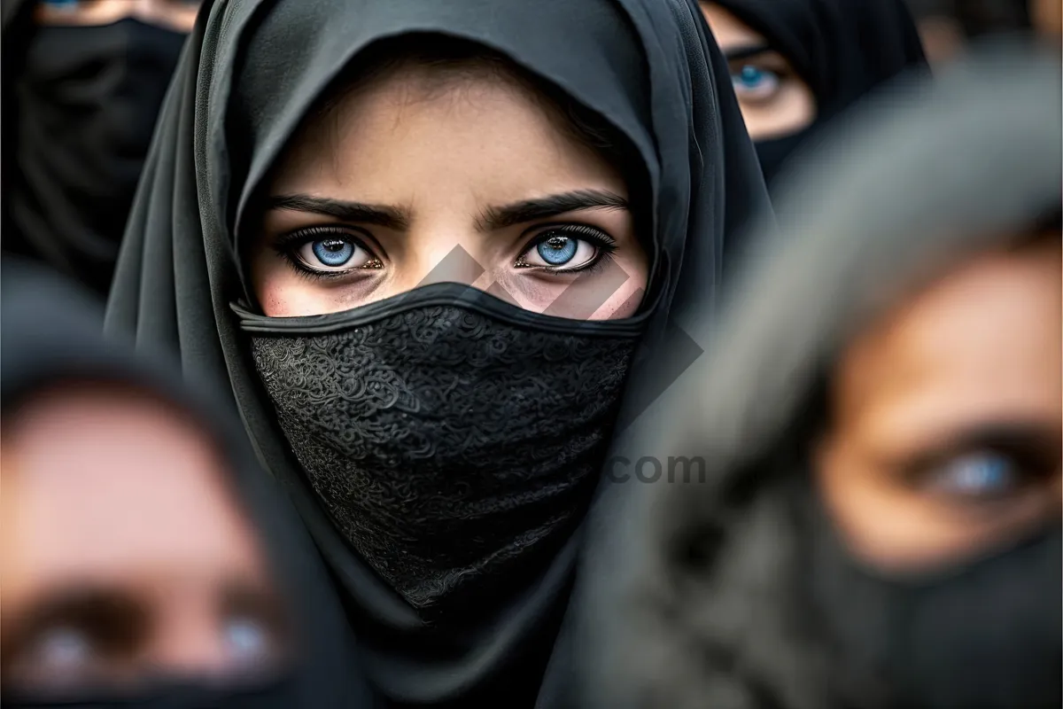 Picture of Fashionable lady wearing black ski mask as face covering.