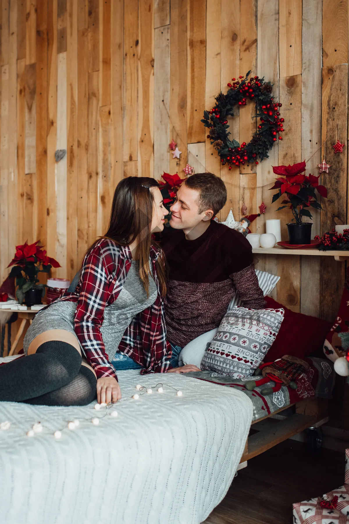 Picture of Happy family on the couch in pajamas.