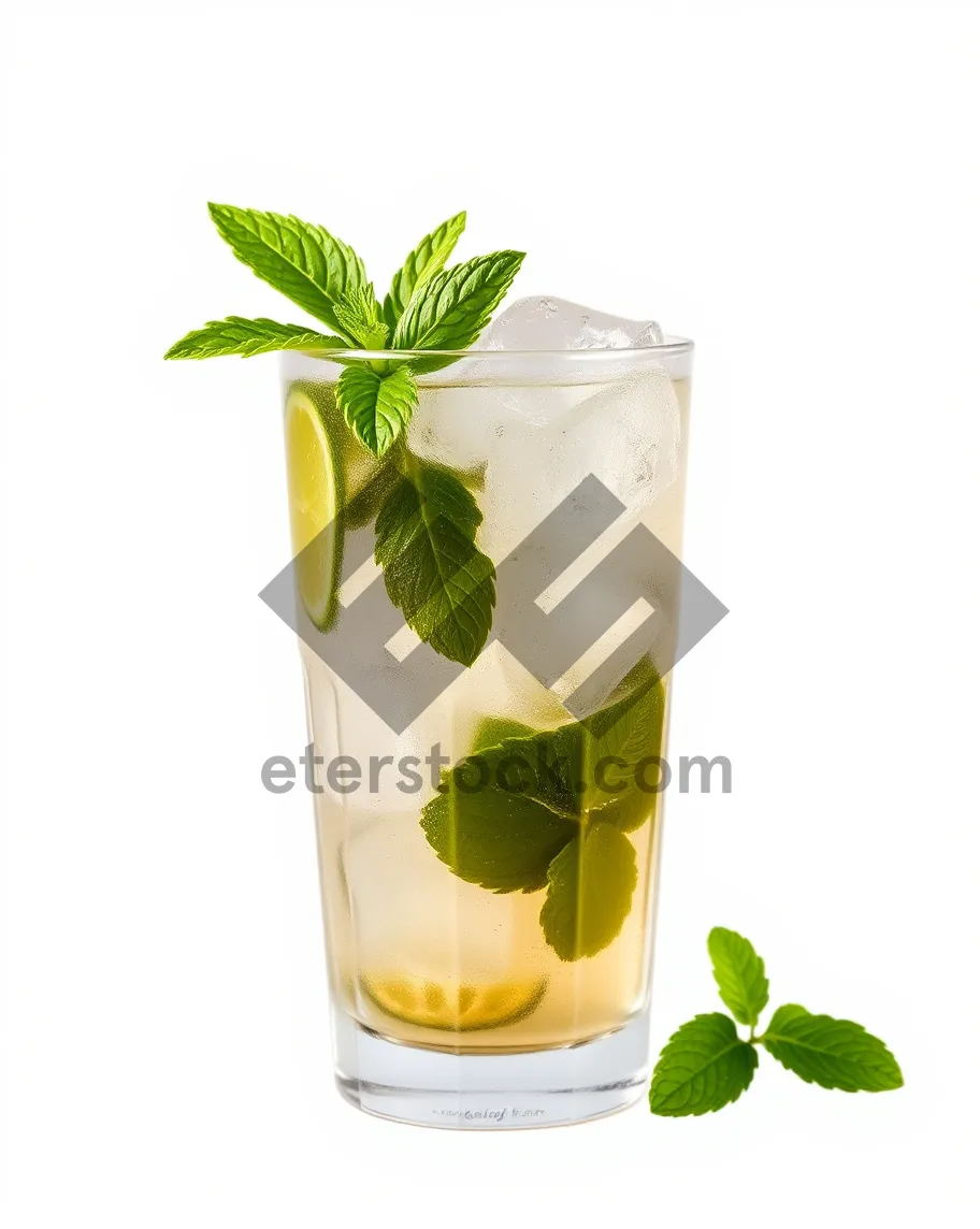 Picture of Refreshing flower cocktail in glass vase with plant leaf.
